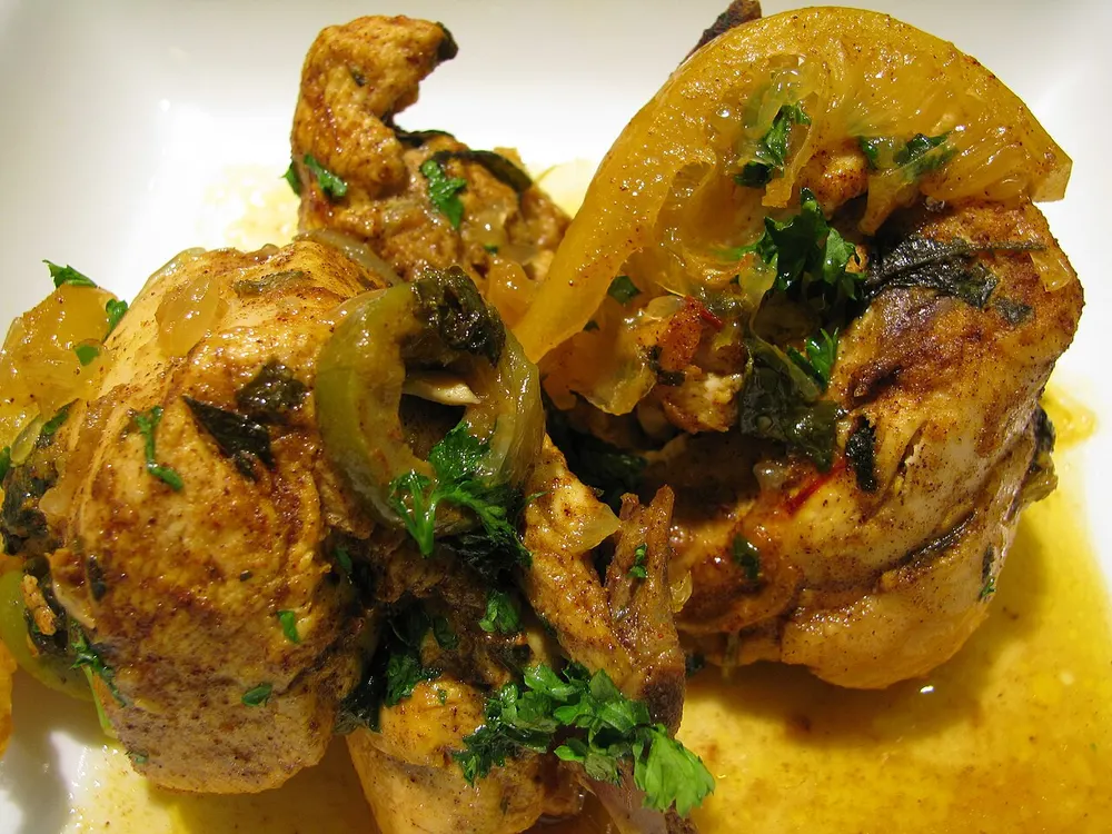 Chicken braised with preserved lemon, green olives and saffron-onion sauce